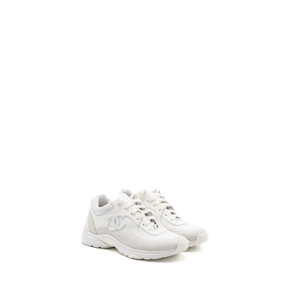 Triple white hot sale chanel sneakers