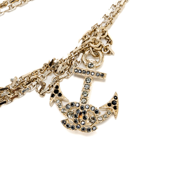 Chanel long necklace with multi charms light gold tone