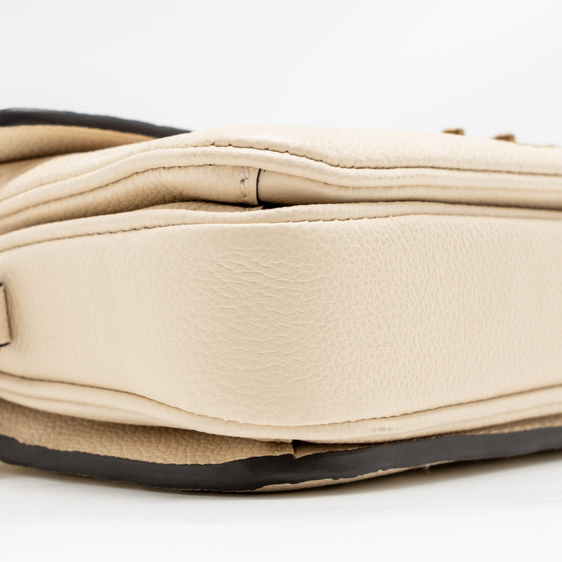Louis Vuitton Pochette Métis East West Monogram Empreinte Leather Cream GHW