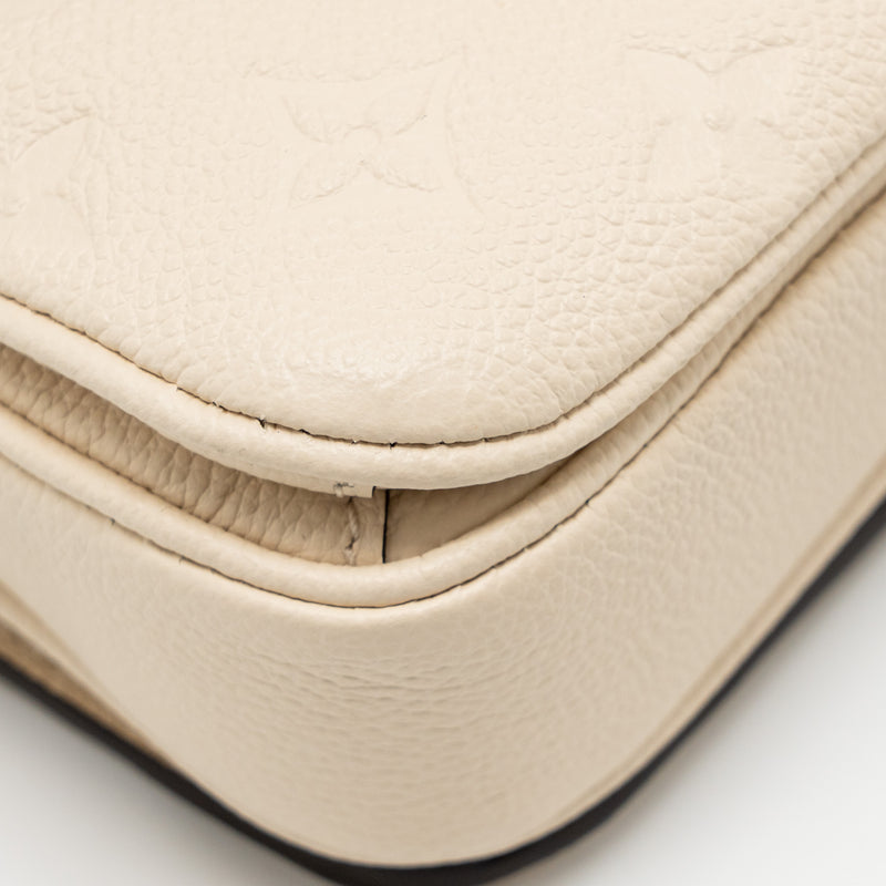 Louis Vuitton Pochette Métis East West Monogram Empreinte Leather Cream GHW