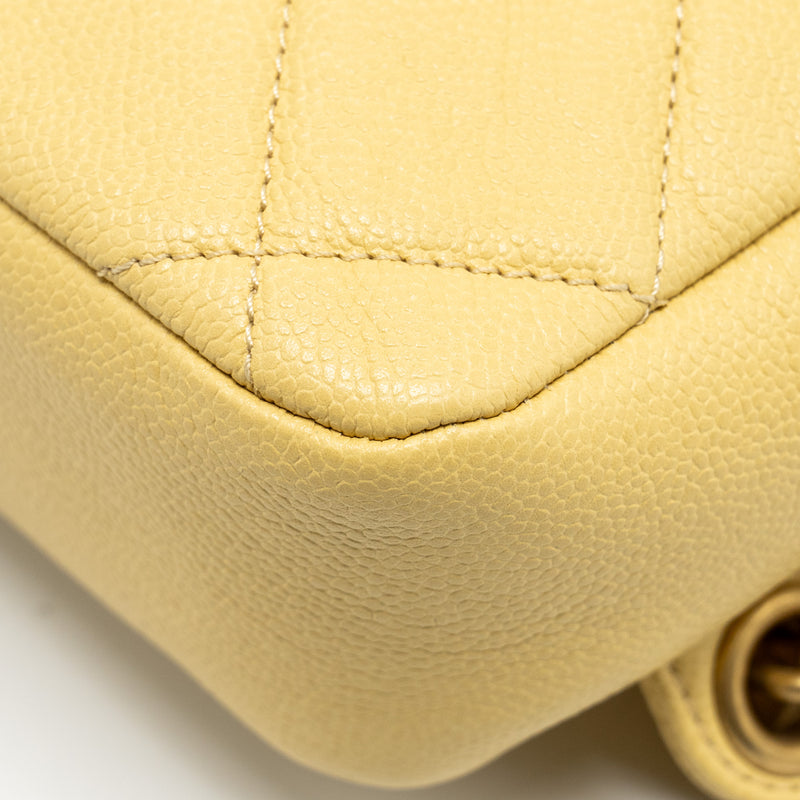 Chanel 22P quilted flap backpack caviar light yellow GHW (Microchip)