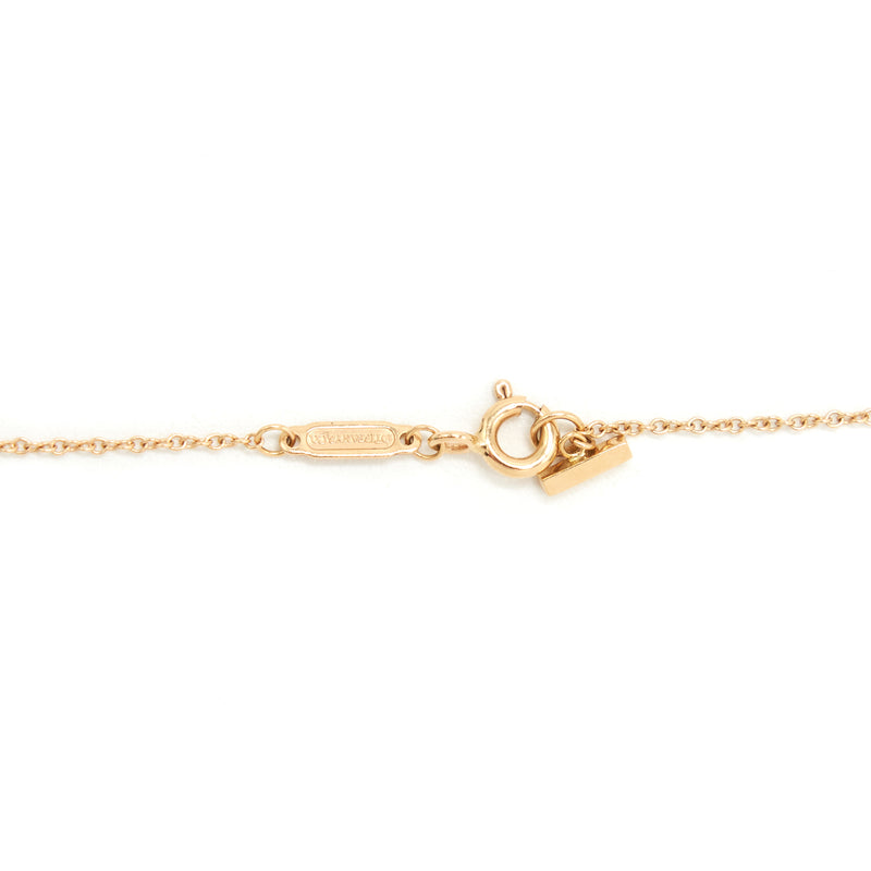 Tiffany T open vertical diamond bar pendant in 18k gold. | Tiffany & Co.